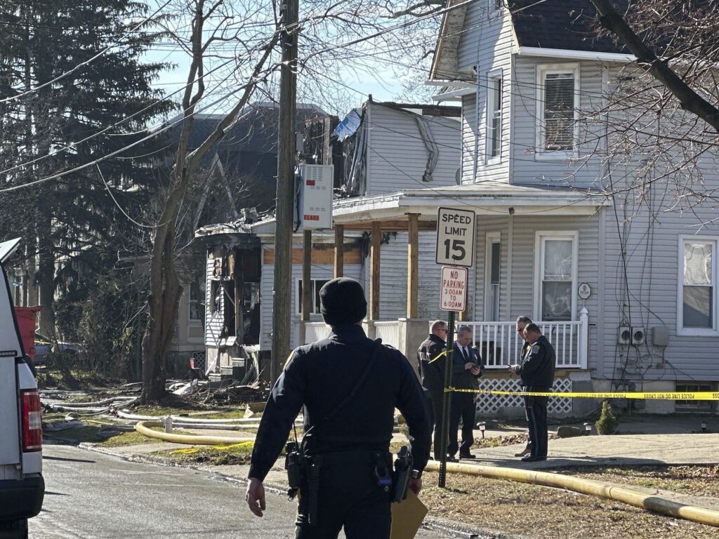 Officers Wounded House Fire Police at the scene of the fire and shooting