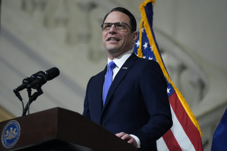 Gov. Josh Shapiro speaking at a podium