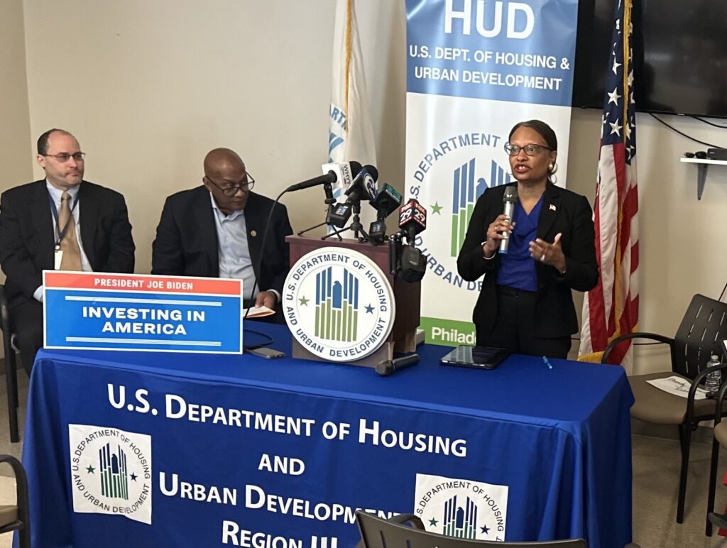 Adrianne Todman speaking at a podium