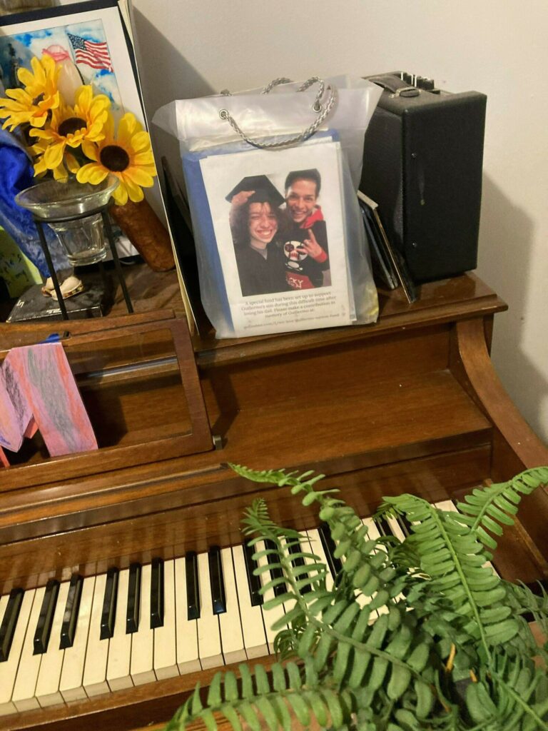 The graduation photo adorns containers holding the ashes of Guillermo's father.