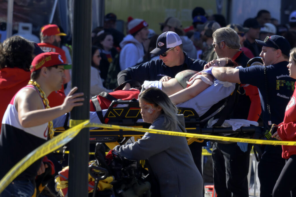 Super Bowl Chiefs Parade Football A woman on a stretcher is taken from the scene of the shooting.