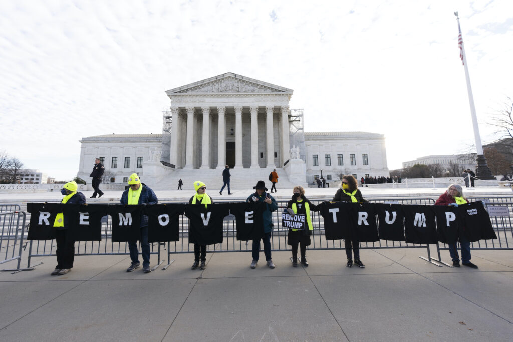 Supreme Court Fourteenth Amendment Protesters holding a banner in front of the Supreme COurt that says 'Remove Trump'