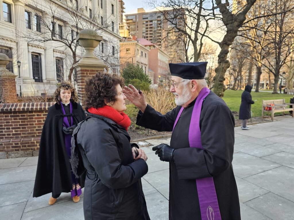ashes-to-go-t-macdonald-2024-02-14-3 Reverend Dick Ullman giving someone ashes