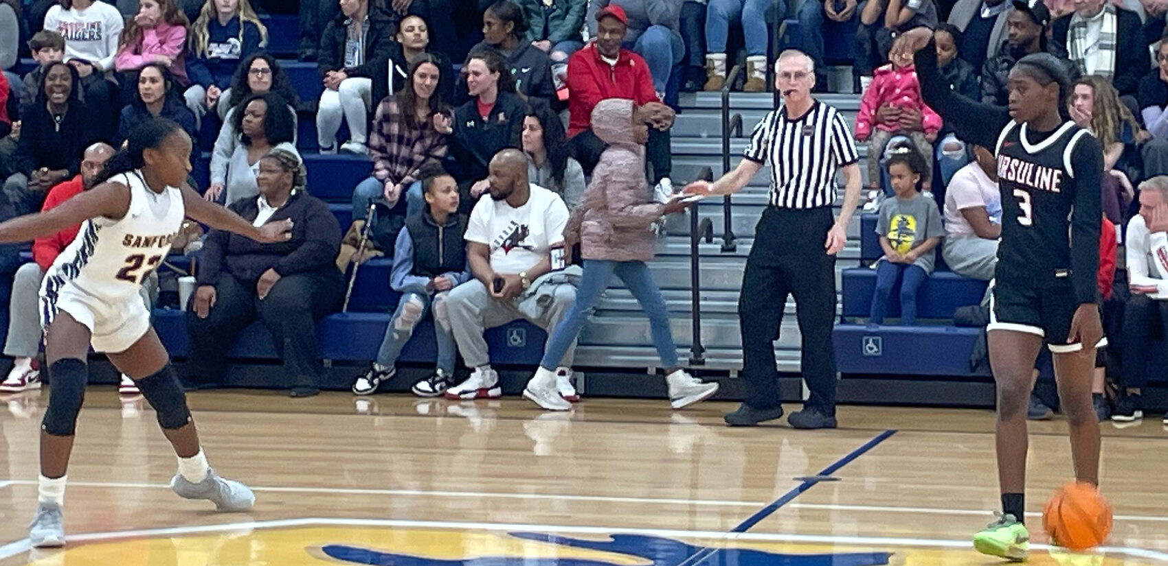 Banks dribbling the ball up the court