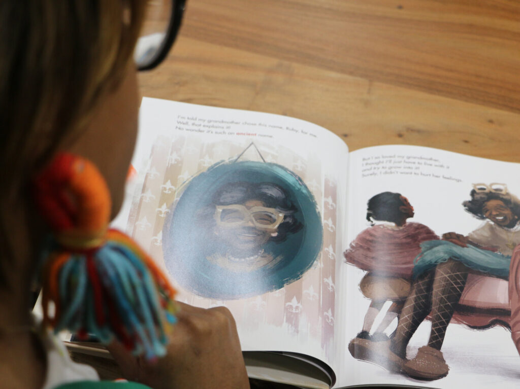 Brittni Robertson Powell, with the New Orleans-based bookstore Baldwin & Co. looks through her choice for Black History Month: I Am Ruby Bridges.
