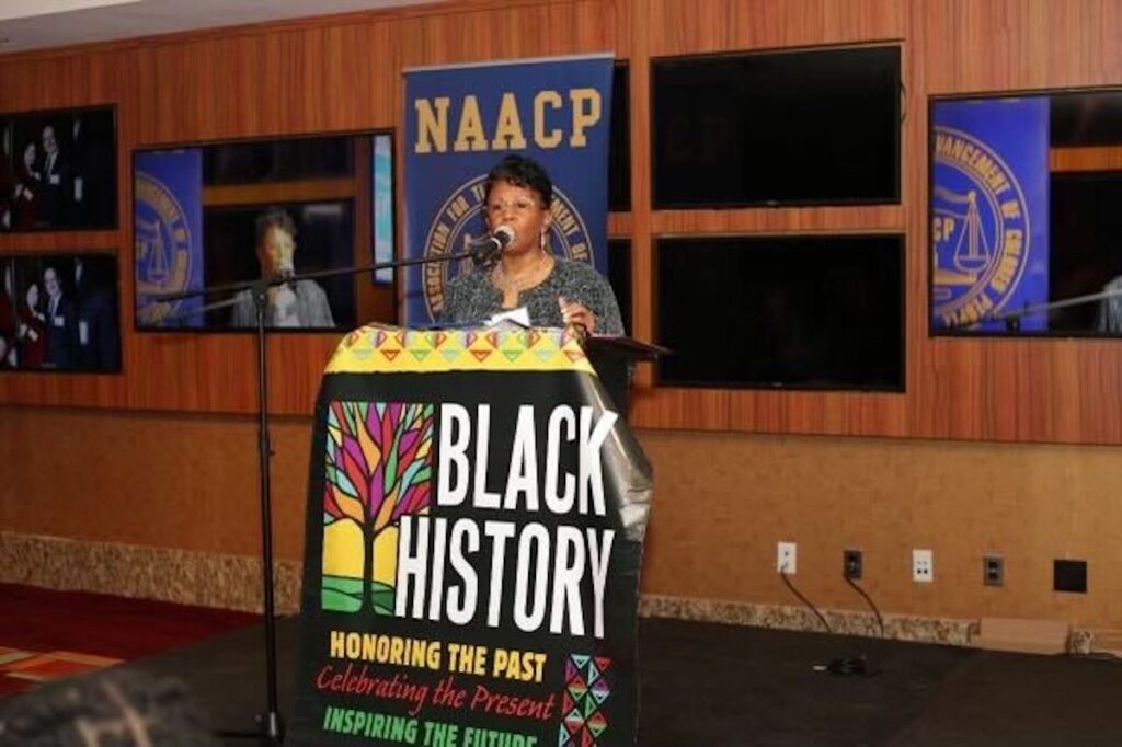 bucks-county-naacp-2024-02-01 Karen Downer speaking at a podium