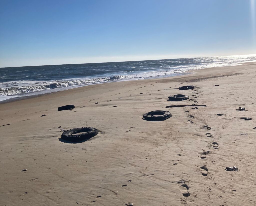 Tires strewn along the beach