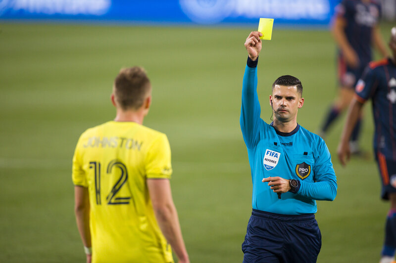 FC Cincinnati v Nashville SC Alistair Johnston of Nashville SC is issued a yellow card during the second half of a match against FC Cincinnati at Nissan Stadium on April 17, 2021 in Nashville.