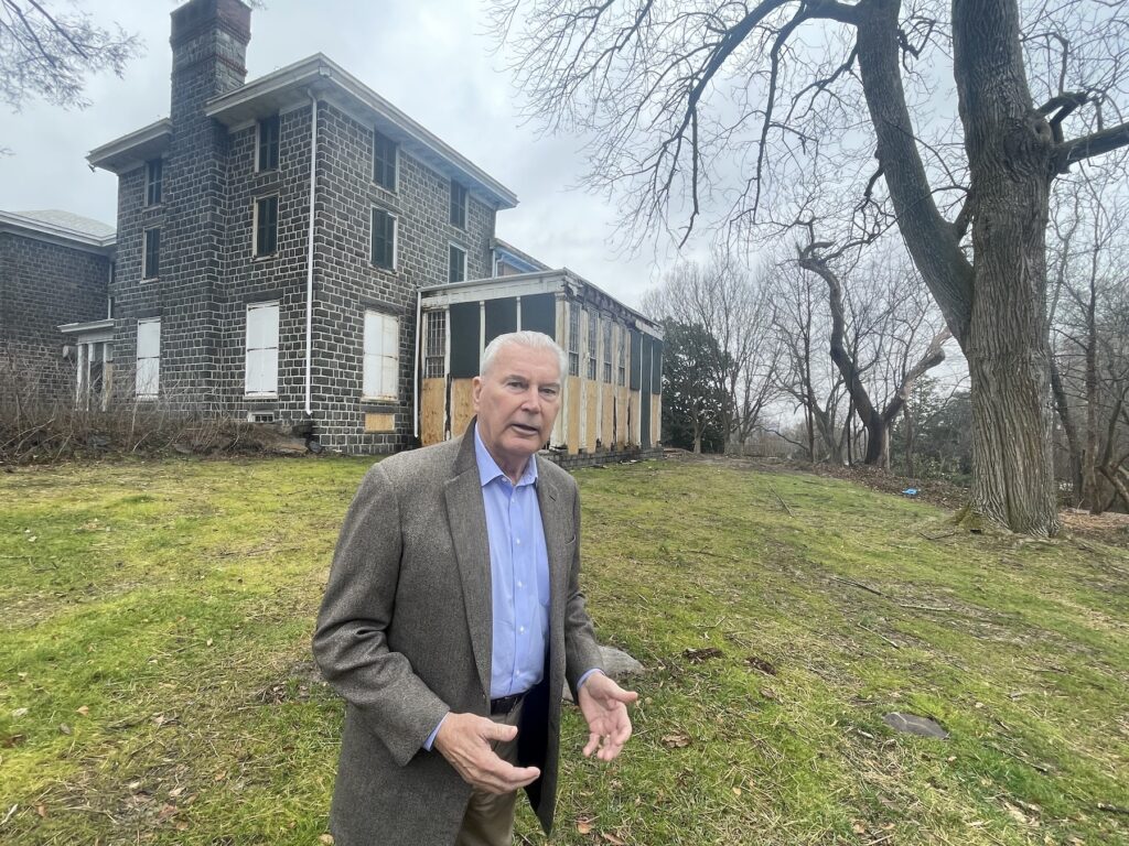 Mayor Purzycki standing outside in front of the building