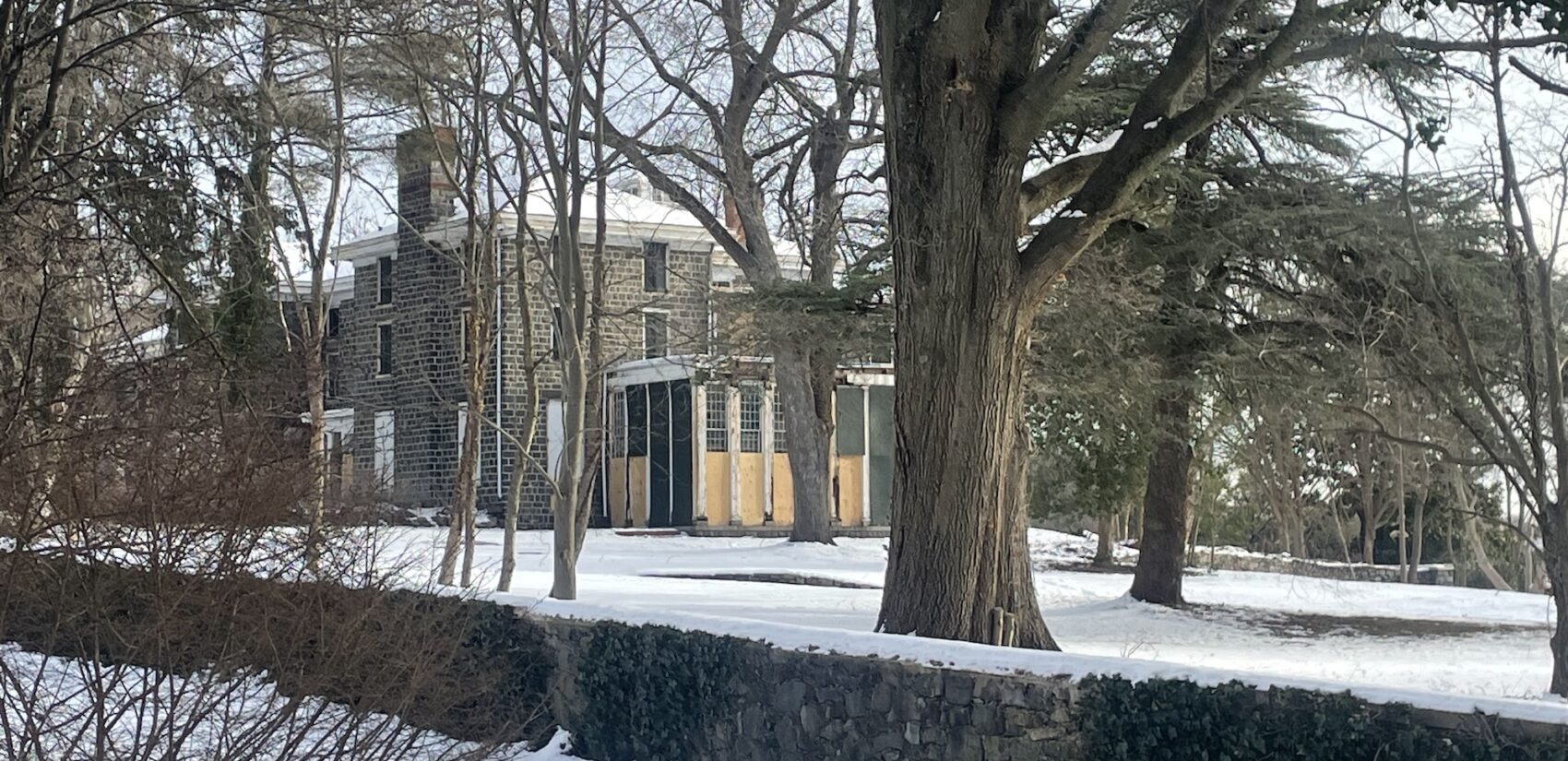 A wall surrounds the estate, which is covered in snow