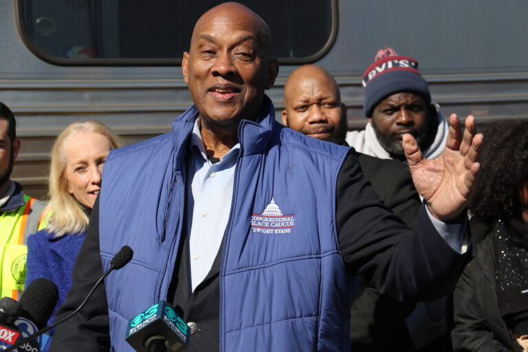 U.S. Representative Dwight Evans speaks at a podium