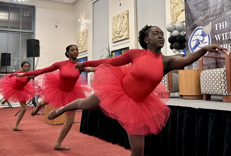Three ballet dancers perform at the event.