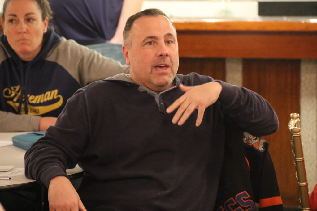 Jeff Travelina speaks during a discussion