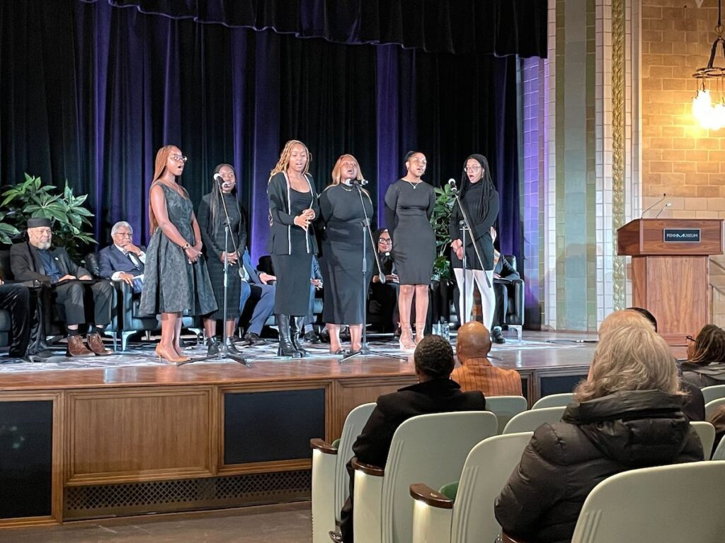 The New Spirit of Penn Gospel Choir performed a musical interlude.