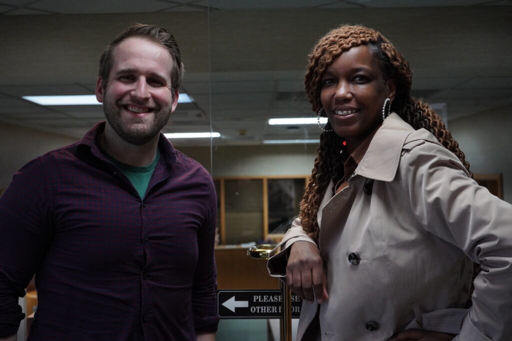 Defense attorneys Nathan Orians and Devon Potts pose for a photo