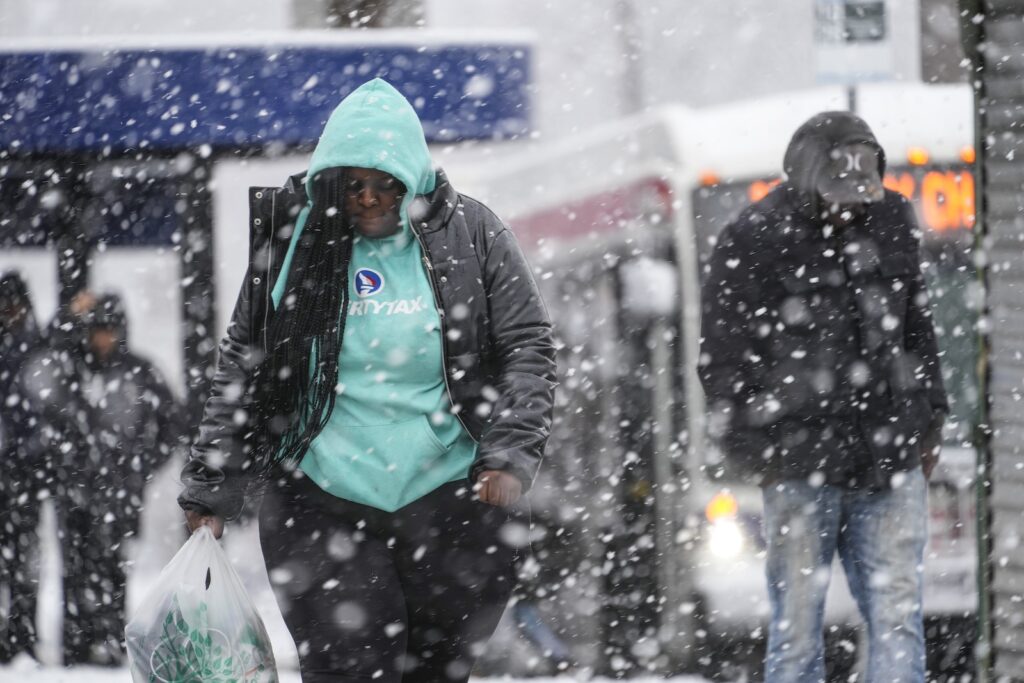 Winter Weather People walk during a winter snow storm in Philadelphia, Tuesday, Feb. 13, 2024.