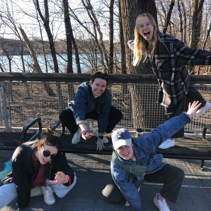 Adults and children pose for a photo in Fairmount Park