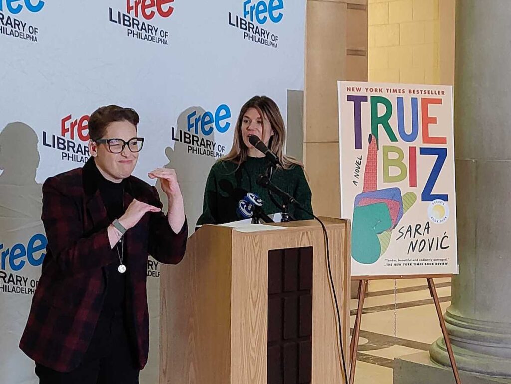 Sara Novic speaks at an event