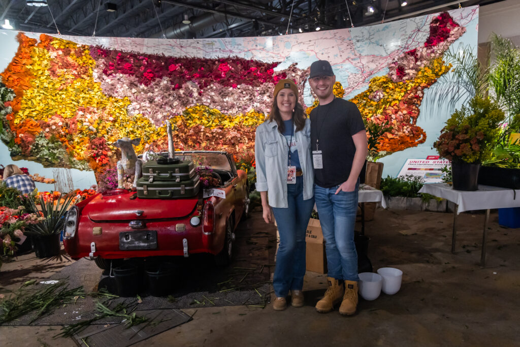 Jennifer Reed and Chris Clark posing at the Flower Show