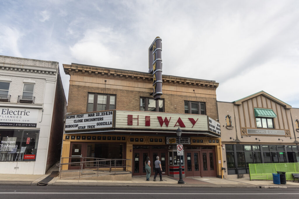 A sign reads "Hiway" on the exterior of the Hiway Theater in Jenkintown