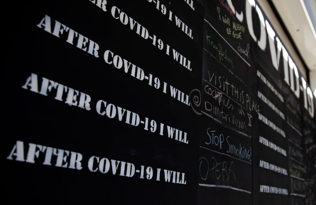 Messages are written in chalk on a COVID-19 message board, during a partial lockdown to prevent the spread of coronavirus, COVID-19, in Antwerp, Belgium, Thursday, May 14, 2020. Belgium has taken a major step in the relaxation of its lockdown with the opening of many of its shops, but under strict conditions.(AP Photo/Virginia Mayo)