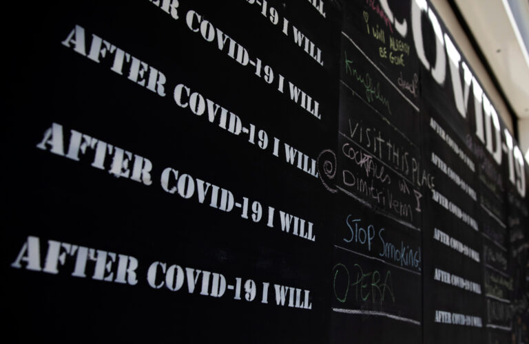 Messages are written in chalk on a COVID-19 message board, during a partial lockdown to prevent the spread of coronavirus, COVID-19, in Antwerp, Belgium, Thursday, May 14, 2020. Belgium has taken a major step in the relaxation of its lockdown with the opening of many of its shops, but under strict conditions.(AP Photo/Virginia Mayo)
