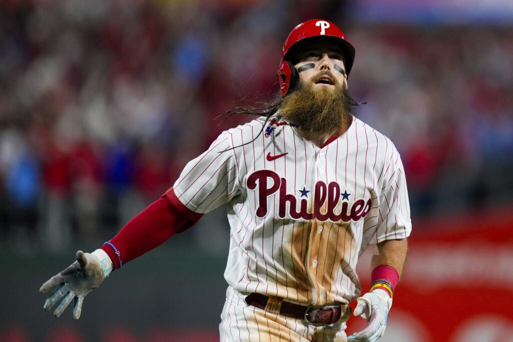 Philadelphia Phillies' Brandon Marsh hits a home run during the eighth inning of Game 3 of a baseball NL Division Series against the Atlanta Braves Wednesday, Oct. 11, 2023, in Philadelphia.