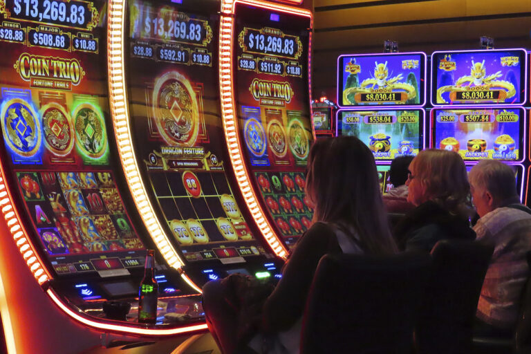 Gamblers play slot machines at the Ocean Casino Resort in Atlantic City, N.J. on Nov. 29, 2023. Figures released on Tuesday, Feb. 20, 2024, by the American Gaming Association show that the U.S. commercial casino industry had its best year ever in 2023, winning $66.5 billion from gamblers. When figures from tribal casinos are tallied later this year, the combined total is expected to approach $110 billion for 2023. (AP Photo/Wayne Parry)