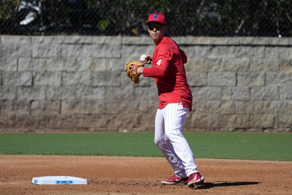 Philadelphia Phillies infielder Scott Kingery throws to first base during a baseball spring training workout Thursday, Feb. 22, 2024, in Clearwater, Fla.
