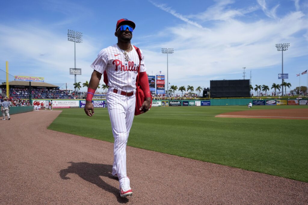 AP24059741482469-scaled Philadelphia Phillies center fielder Johan Rojas walks on the field before a spring training baseball game against the Atlanta Braves Wednesday, Feb. 28, 2024, in Clearwater, Fla. (AP Photo/Charlie Neibergall)