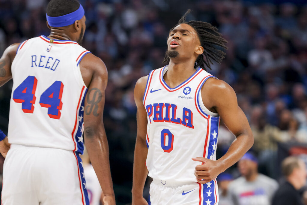 Philadelphia 76ers guard Tyrese Maxey (0) celebrates with forward Paul Reed (44) during the first half of an NBA basketball game against the Dallas Mavericks, Sunday, March 3, 2024, in Dallas.