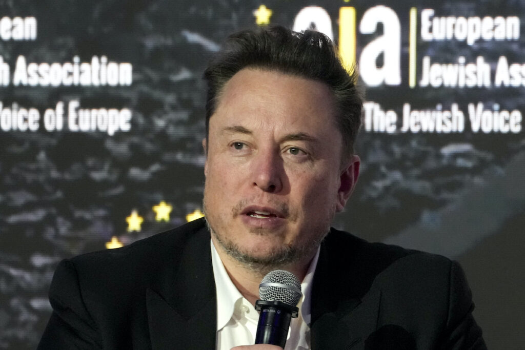 Tesla and SpaceX CEO Elon Musk addresses the European Jewish Association's conference, Jan. 22, 2024, in Krakow, Poland. Former senior executives of Twitter filed suit against Musk and X Corp. on Monday, March 4, saying they are entitled to more than $128 million total in unpaid severance payments.