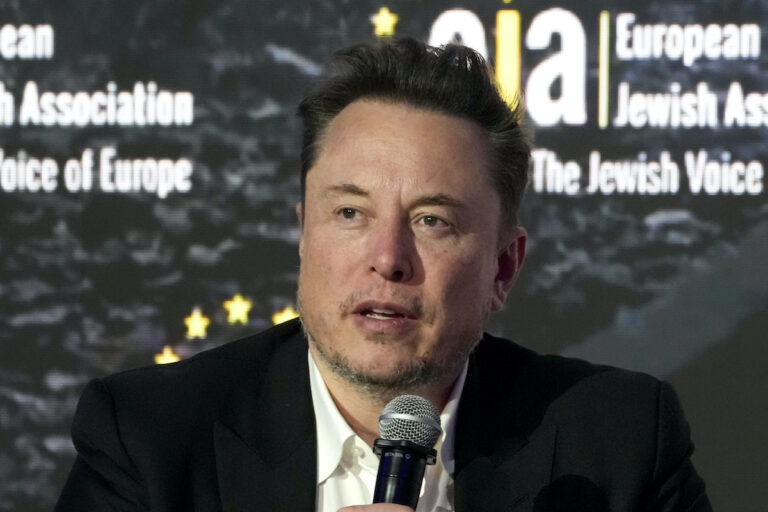 Tesla and SpaceX CEO Elon Musk addresses the European Jewish Association's conference, Jan. 22, 2024, in Krakow, Poland. Former senior executives of Twitter filed suit against Musk and X Corp. on Monday, March 4, saying they are entitled to more than $128 million total in unpaid severance payments.