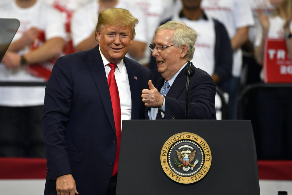 File photo: Then President Donald Trump (left) and Senate Minority Leader Mitch McConnell of Ky., greet each other during a campaign rally in Lexington, Ky., Nov. 4, 2019. McConnell has endorsed Donald Trump for president.