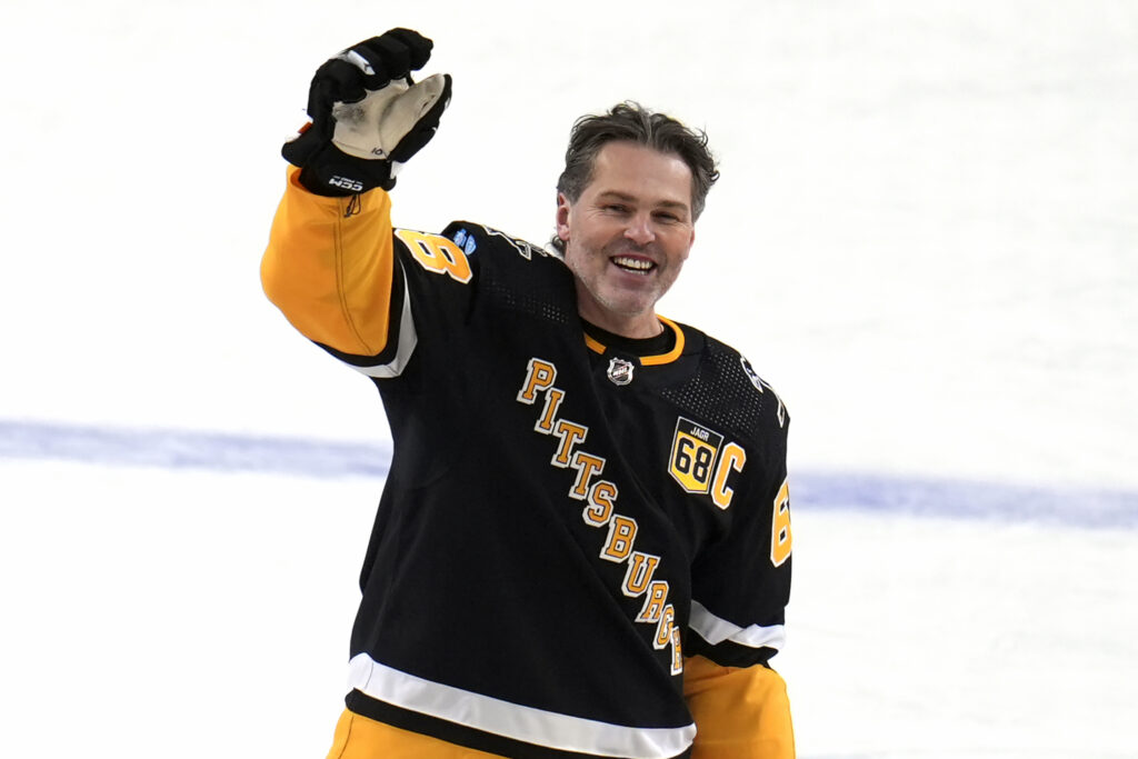 Penguins Jagr Biobblehead Hockey File photo: Former Pittsburgh Penguins player Jaromir Jagr stands at center ice and waves to fans after skating during warm ups after having a banner with his retired uniform number raised to the rafters of PPG Paints arena before an NHL hockey game between the Los Angeles Kings and the Penguins in Pittsburgh, Sunday, Feb. 18, 2024.