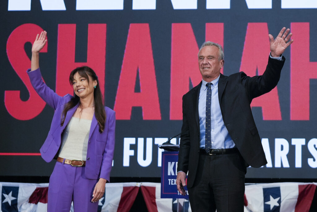 Robert F. Kennedy Jr. Presidential candidate Robert F. Kennedy Jr. (right) waves on stage with Nicole Shanahan, after announcing her as his running mate, during a campaign event, Tuesday, March 26, 2024, in Oakland, Calif. (AP Photo/Eric Risberg)