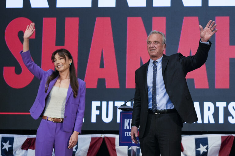 Presidential candidate Robert F. Kennedy Jr. (right) waves on stage with Nicole Shanahan, after announcing her as his running mate, during a campaign event, Tuesday, March 26, 2024, in Oakland, Calif. (AP Photo/Eric Risberg)