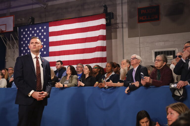 Biden supporters listen to the president speak