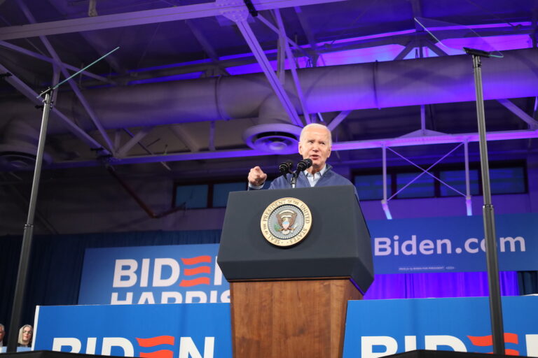 President Joe Biden speaks at a podium