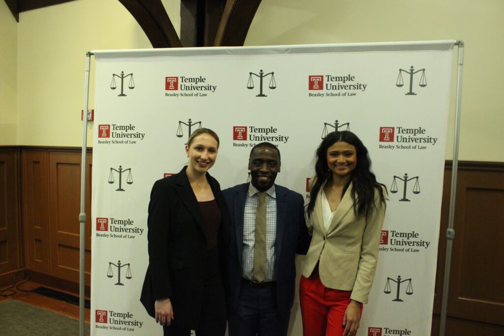 Olivia Vance, a member of Temple women's volleyball team, Councilmember-At-Large Isaiah Thomas, who introduced the legislation and Jaaliyah Evans, also a member of the volleyball team.