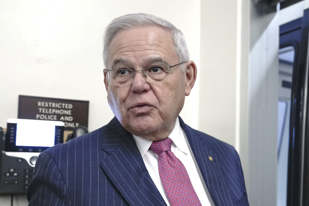 Menendez. Bob Menendez standing in a hallway