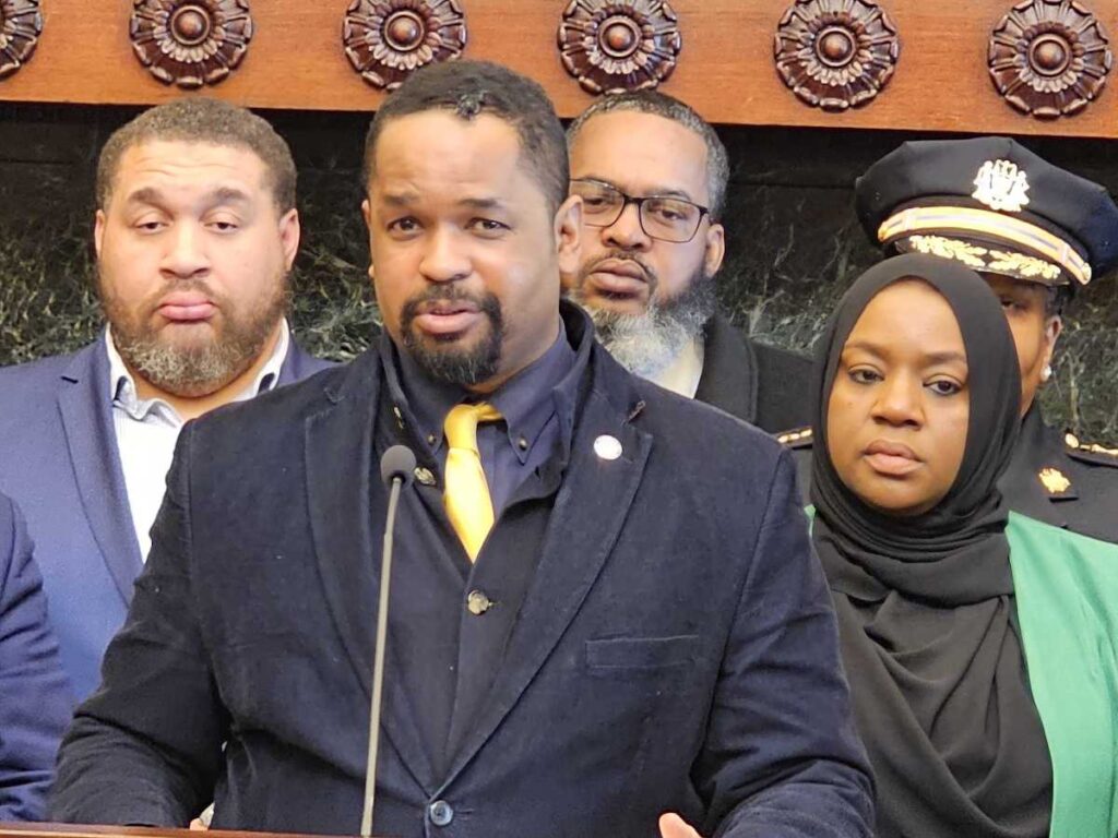 State Senator Sharif Street, center, speaks along with BLMC head Salima Suswell, right