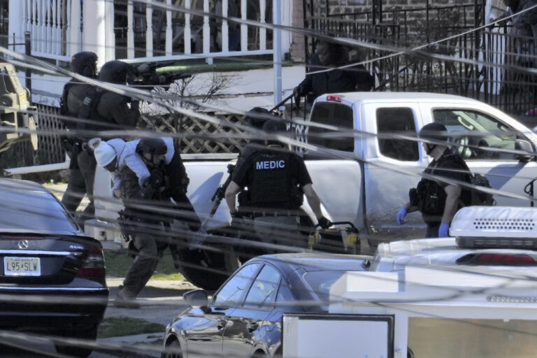 A resident is evacuated from a home in Trenton, N.J. on Saturday, March 16, 2024.