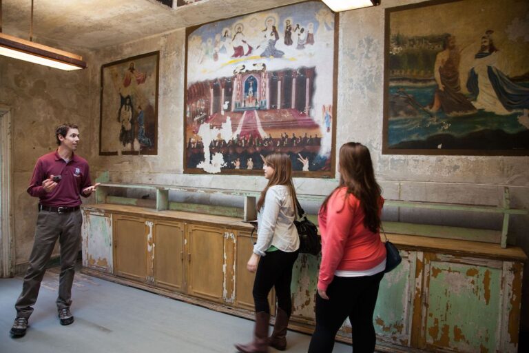 Visitors in a room at Eastern State Penitentiary