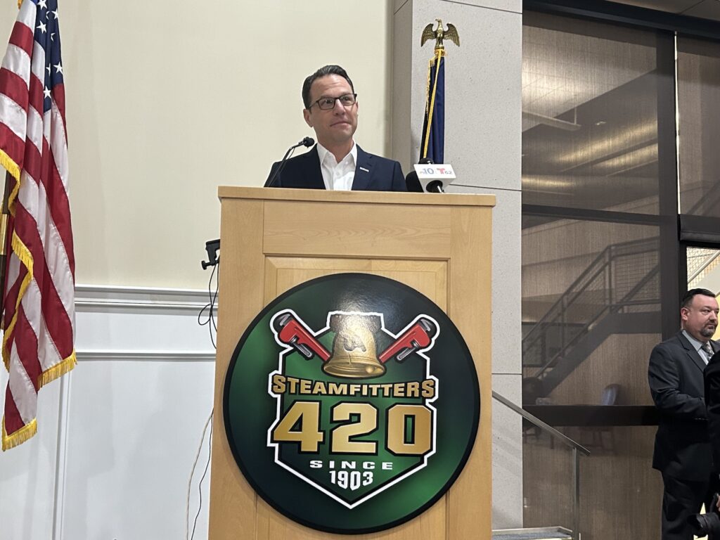 Josh Shapiro speaking at a podium