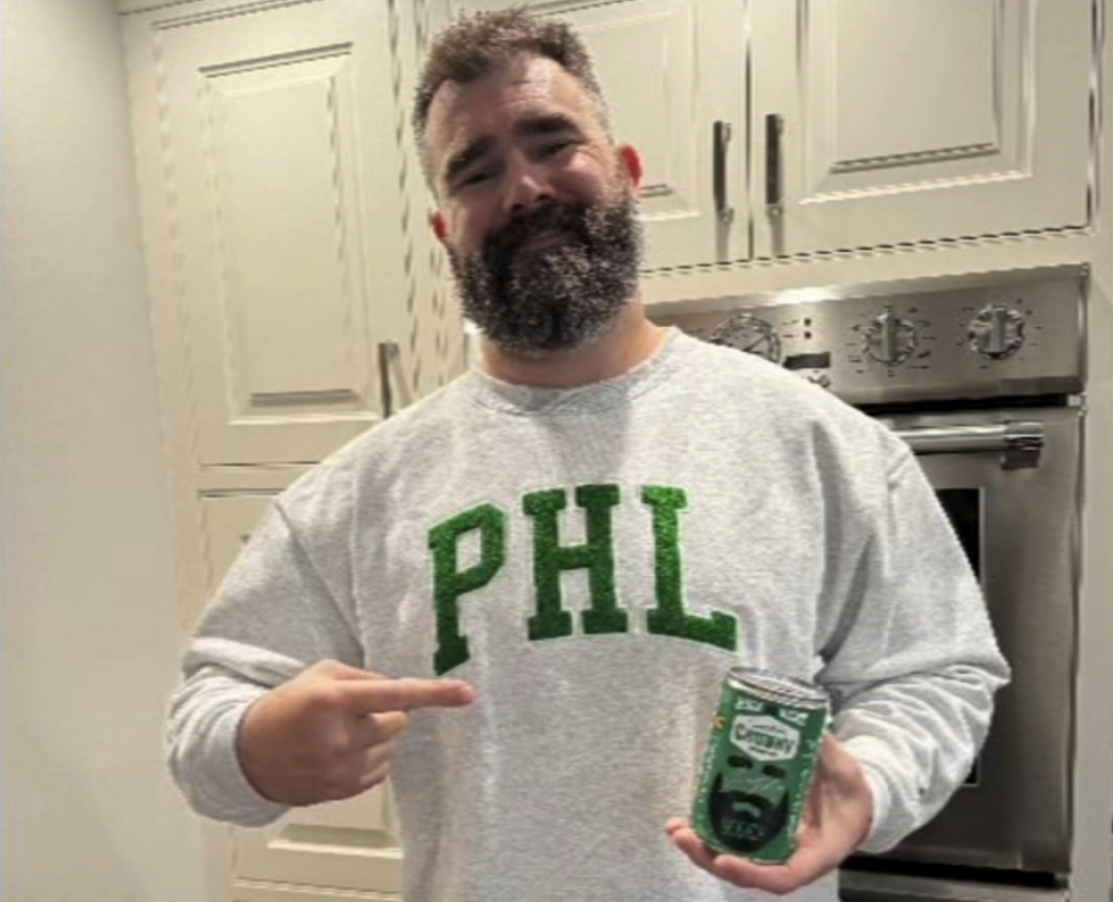 Jason Kelce holding a can of soup