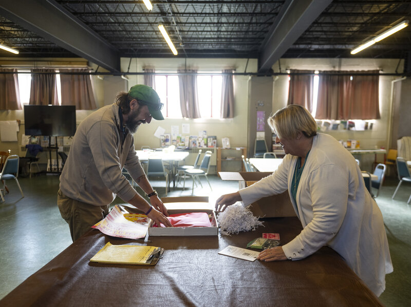 Kim Botteicher and David Peightal working at a table