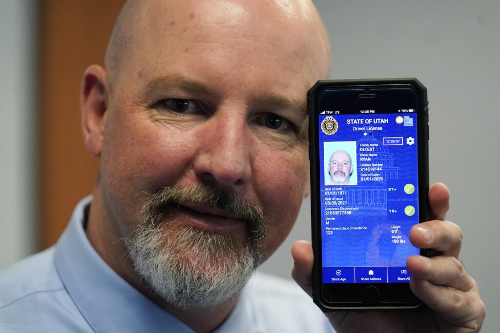 Digital Driver’s Licenses Ryan Williams, with the Utah Drivers License Division, displayes his cell phone with a pilot version of the state's mobile ID on Wednesday, May 5, 2021, in West Valley City, Utah.