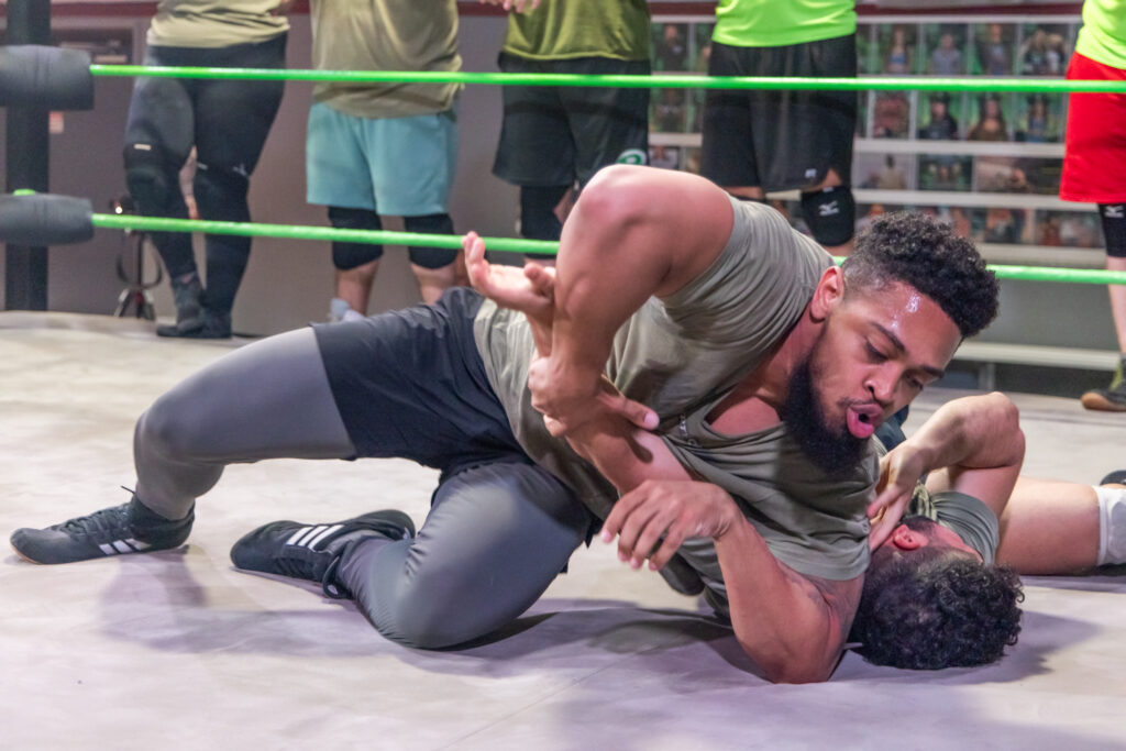 Wrestler Christian Darling pins a contender in the ring at the Monster Factory in Paulsboro, N.J. (Kimberly Paynter/WHYY)
