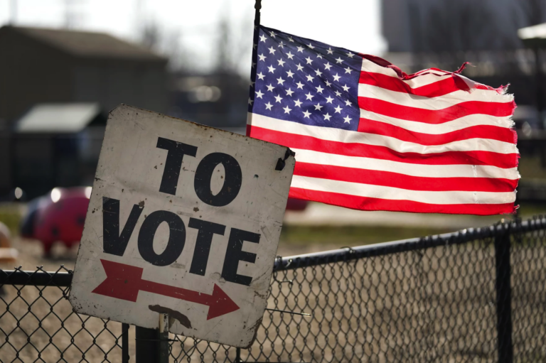 A sign says ''To vote,'' followed by an arrow